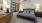 a bedroom with a bed and lamps