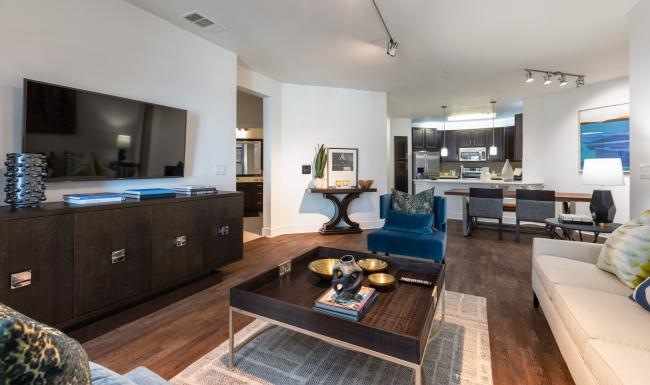 Beautiful living areas to match your lifestyle a living room with a large tv and a couch