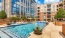 a pool in a courtyard between buildings