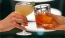 hands holding glasses with cocktails